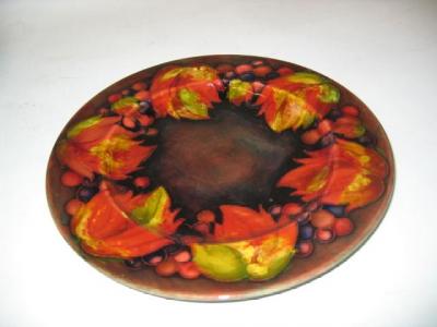 Appraisal: A MOORCROFT POTTERY PLATE of circular form tube lined in