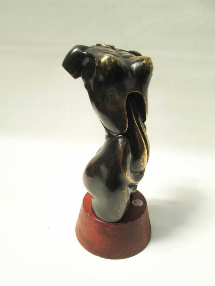 Appraisal: BRONZED METAL FIGURAL SCULPTURE depicting a nude female torso and