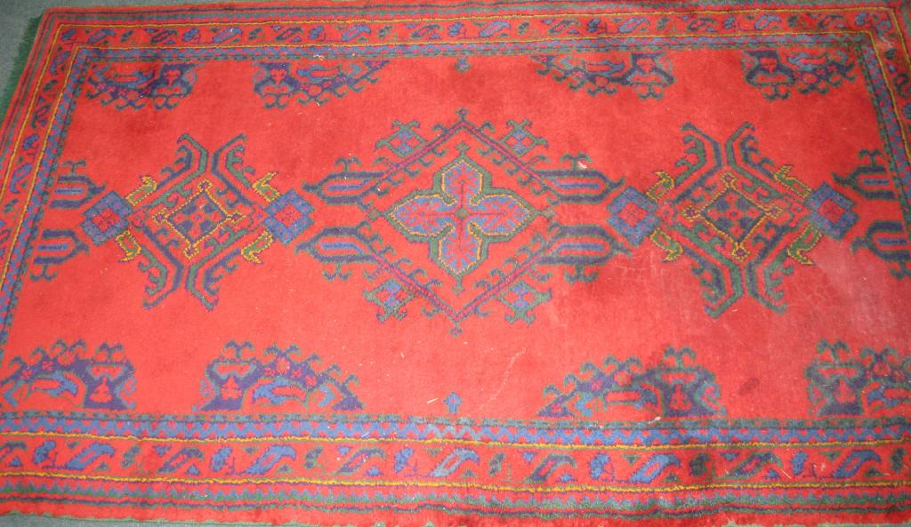 Appraisal: Pair of Turkey bordered Rugs with geometric design on red