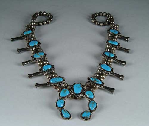 Appraisal: TURQUOISE AND SILVER SQUASH BLOSSOM NECKLACE Double silver bead necklace