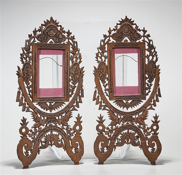 Appraisal: Two Chinese carved wood swivel frames with carved openwork design