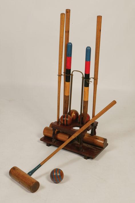 Appraisal: A CROQUET SET on portable stand comprising four mallets two