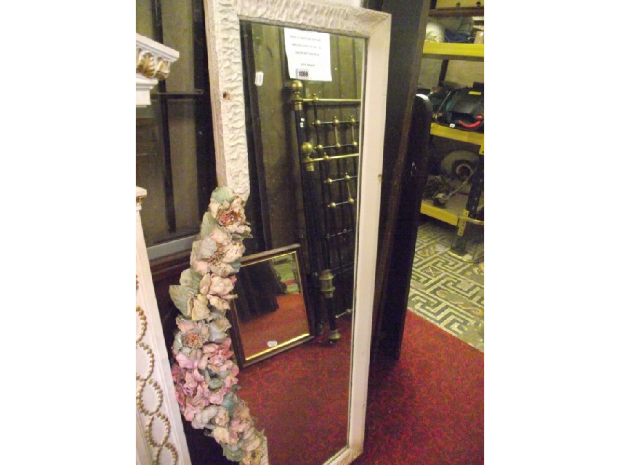 Appraisal: A decorative wall mirror of elongated rectangular form the painted