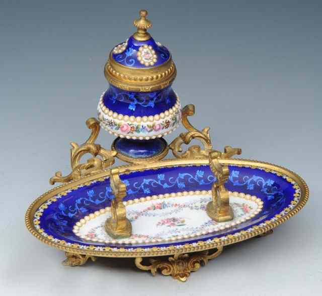 Appraisal: A BLUE ENAMEL OVAL FRENCH DESK STAND decorated with flowers