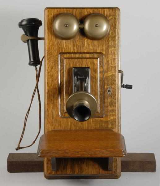 Appraisal: Western Electric Hand Crank Bell Wall Phone Description Working Oak