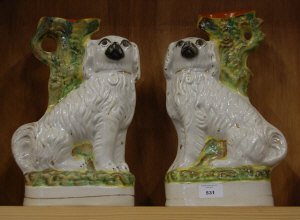 Appraisal: Pair Victorian Staffordshire spaniel spill vases cm