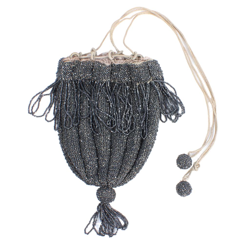 Appraisal: DARK GRAY BEADED DRAWSTRING BAG WITH CELLULOID LOOPS AND BEADED