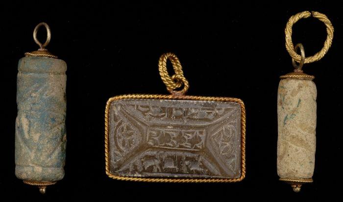 Appraisal: TWO FAIENCE CYLINDRICAL SEAL PENDANTS Together with a rectangular Hebraic