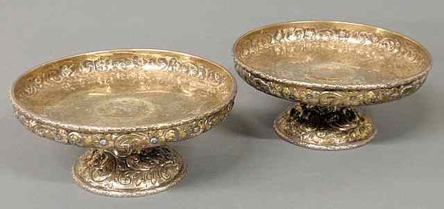 Appraisal: Pair of sterling silver repouss decorated and footed candy dishes