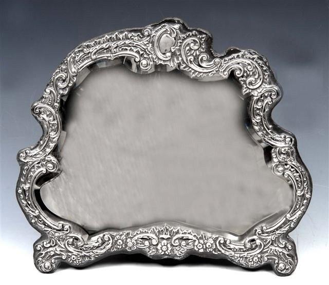 Appraisal: A EDWARD VII SILVER EASEL MIRROR of c-scroll foliate and