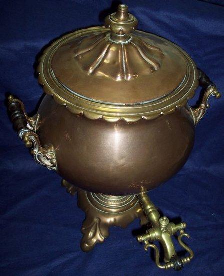 Appraisal: A th Century copper and brass tea urn with two