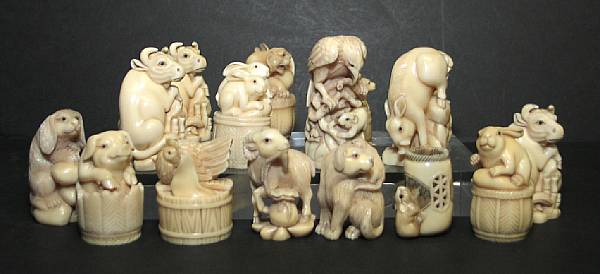 Appraisal: A large group of animal netsuke with inlaid cartouche Simulating