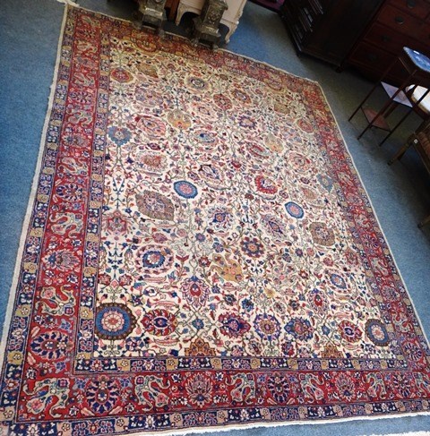 Appraisal: A Tabriz carpet Persian the beige field with an allover