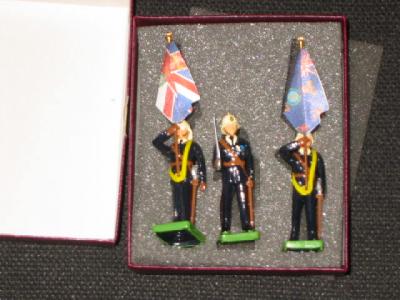 Appraisal: Nine Britains metal Royal Marines three figure standard party sets