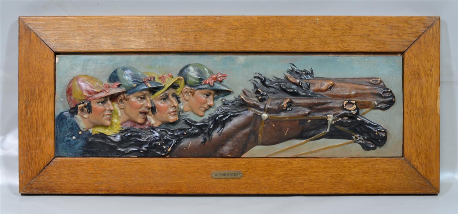 Appraisal: At the Races a molded plaster plaque depicting profiles of