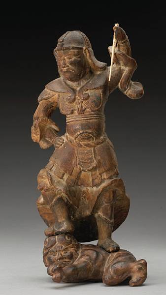 Appraisal: A carved two-section wood guardian figure Edo Period Depicting one