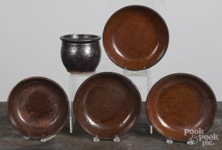 Appraisal: Four redware shallow bowls together with a small crock ''