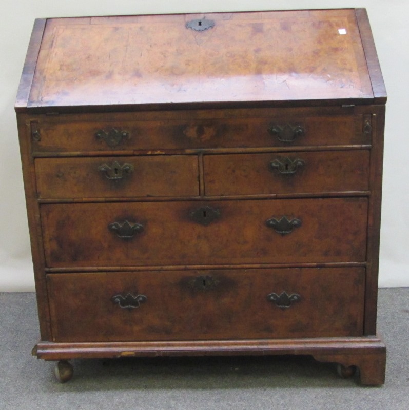 Appraisal: An early th century feather banded figured walnut bureau the