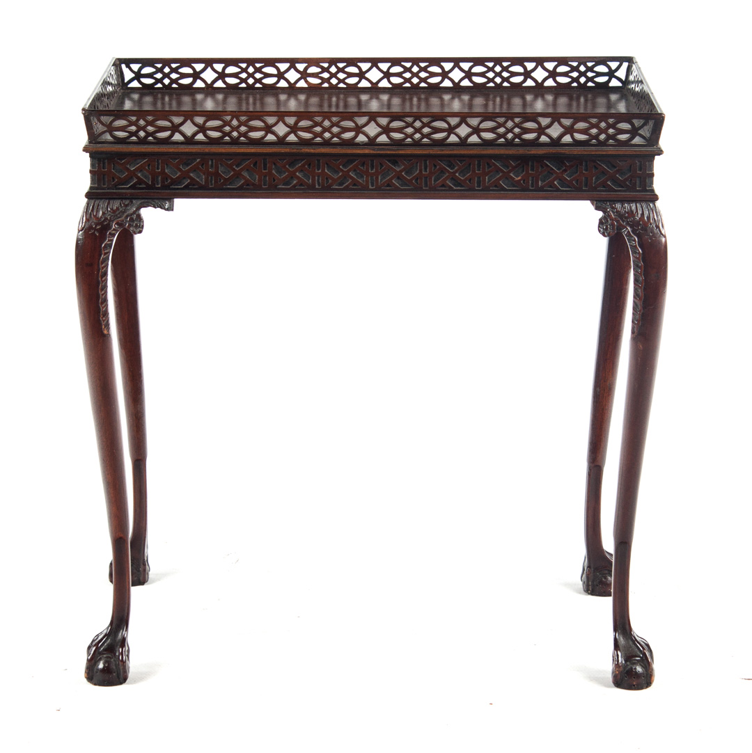 Appraisal: Chippendale style mahogany silver table th century reticulated wood gallery