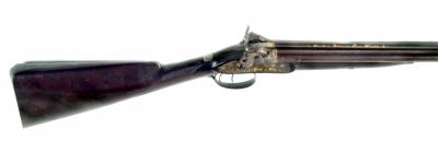 Appraisal: A CONTINENTAL BORE PERCUSSION SHOTGUN with damascus double barrels inscribed