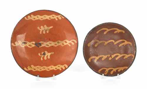 Appraisal: Two slip decorated redware plates th c and dia