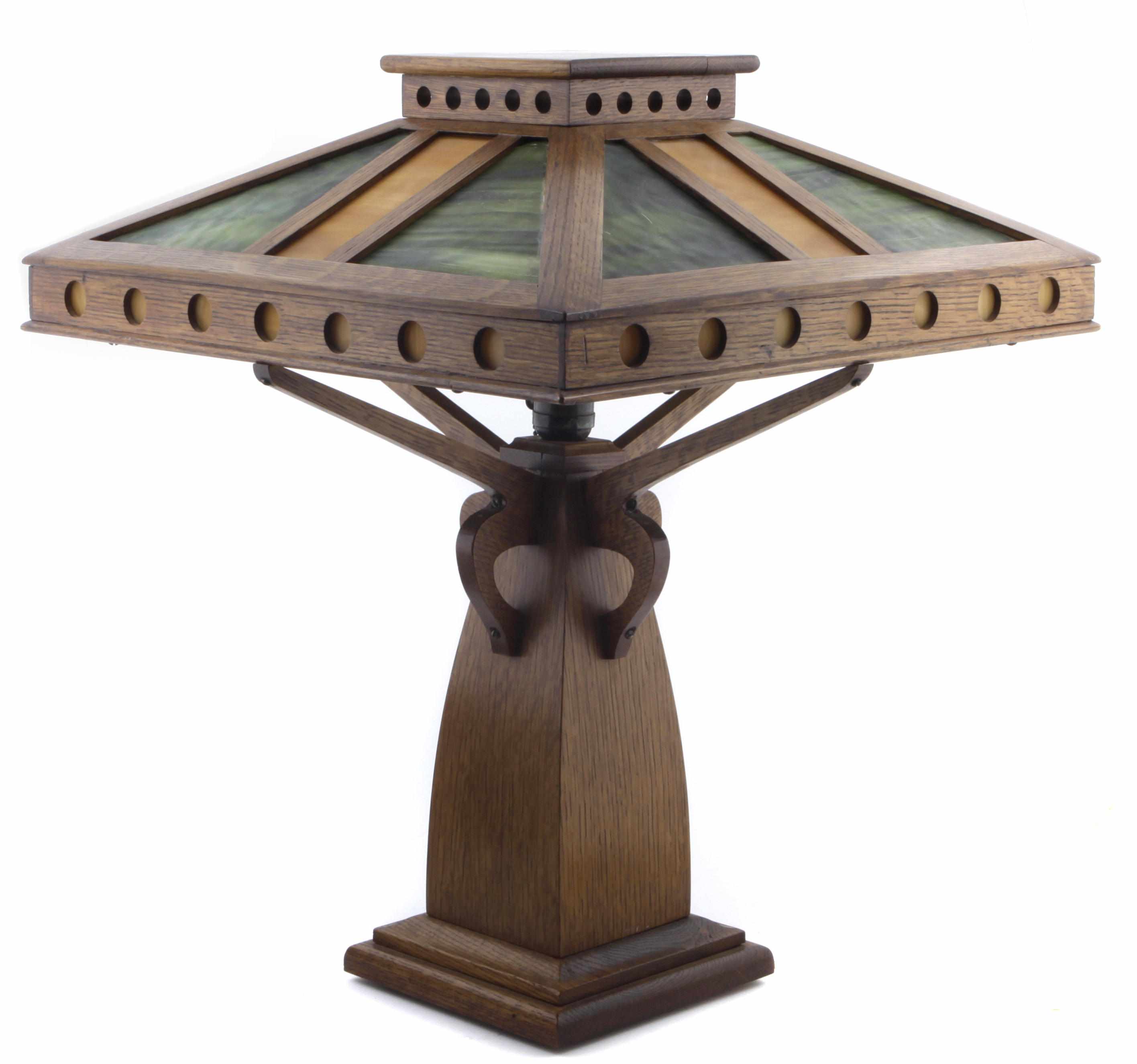 Appraisal: An Arts and Crafts style oak and stained glass lamp