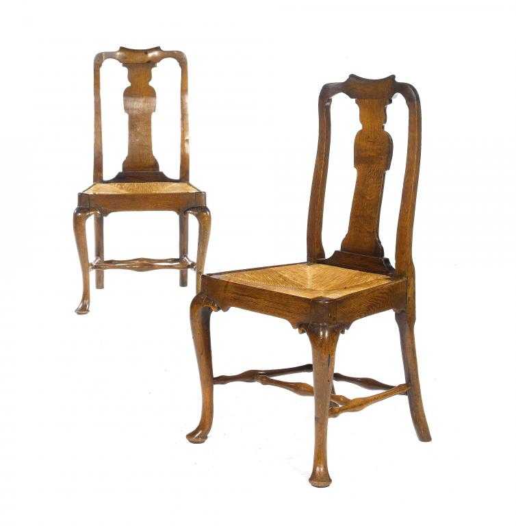 Appraisal: A PAIR OF GEORGE II OAK DINING CHAIRS with spoon