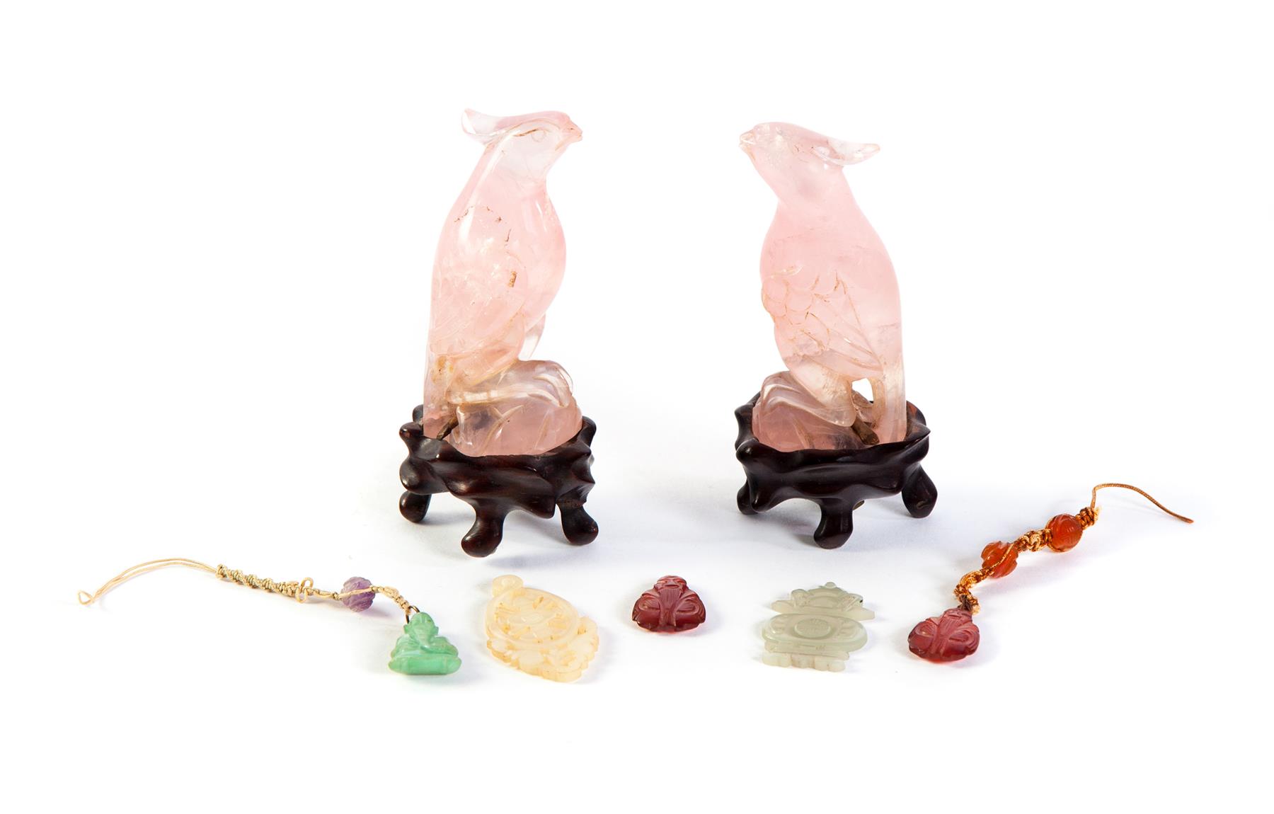 Appraisal: CHINESE PENDANTS AND ROSE QUARTZ BIRDS Twentieth century Two birds