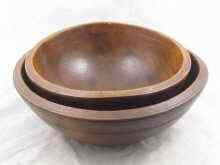 Appraisal: A pair of sycamore nesting hemispherical mixing bowls and cm