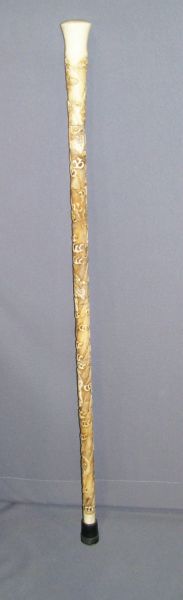 Appraisal: Carved Ivory Cane Eight sections of ivory carved with eight