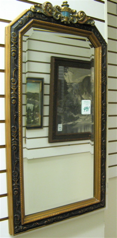 Appraisal: AN ART DECO AMERICAN WALL MIRROR having inset beveled mirror