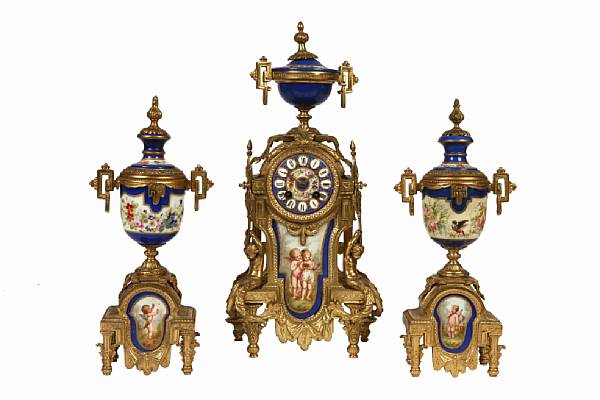 Appraisal: A French gilt metal and porcelain mounted three piece clock