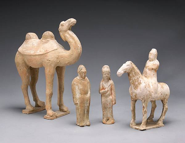 Appraisal: A group of four painted pottery tomb figures Tang Dynasty