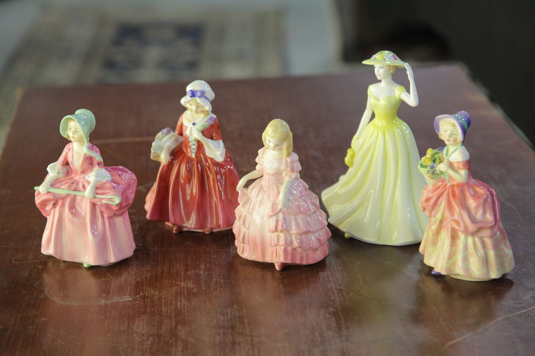 Appraisal: FIVE ROYAL DOULTON FIGURES English th century Spring Time HN