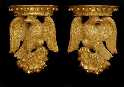 Appraisal: PAIR OF GEORGE III-STYLE CARVED GILTWOOD EAGLE WALL BRACKETS Each