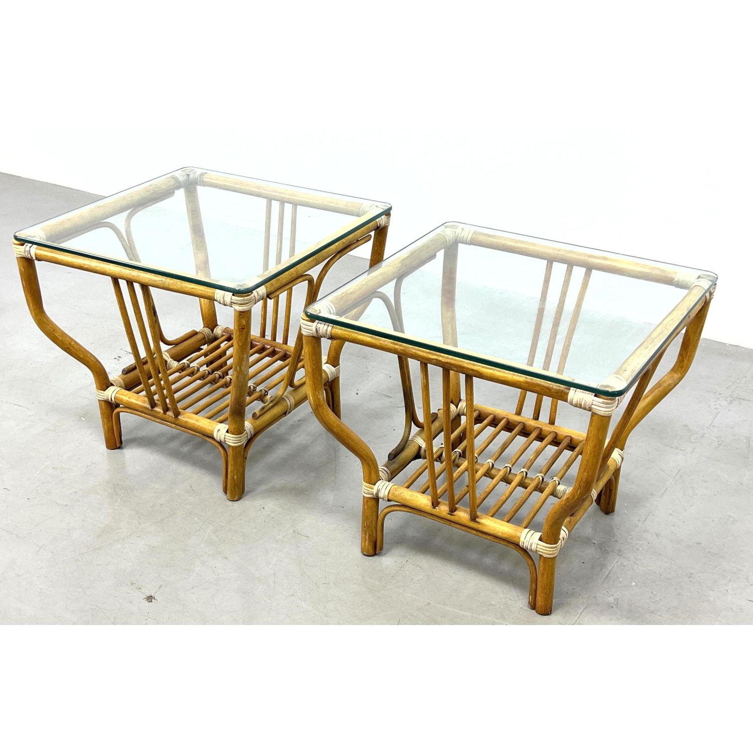 Appraisal: Pair Wicker Rattan end tables with glass tops Dimensions H