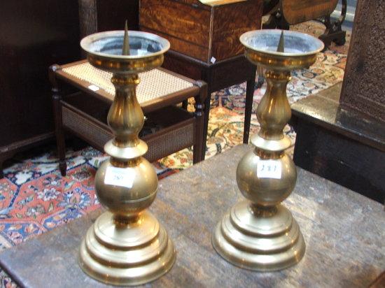 Appraisal: A PAIR OF OLD BRASS PRICKET CANDLESTICKS with baluster turned