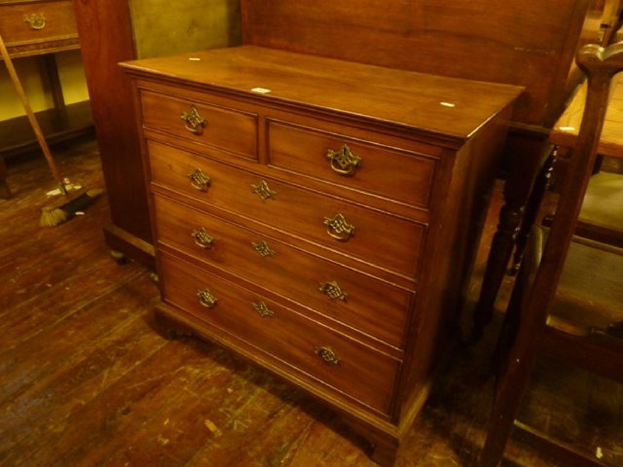 Appraisal: A small th century mahogany bedroom chest of three long