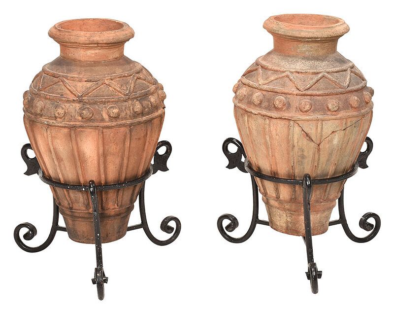 Appraisal: Pair Italian Terracotta Urns Wrought Iron Stands early th century