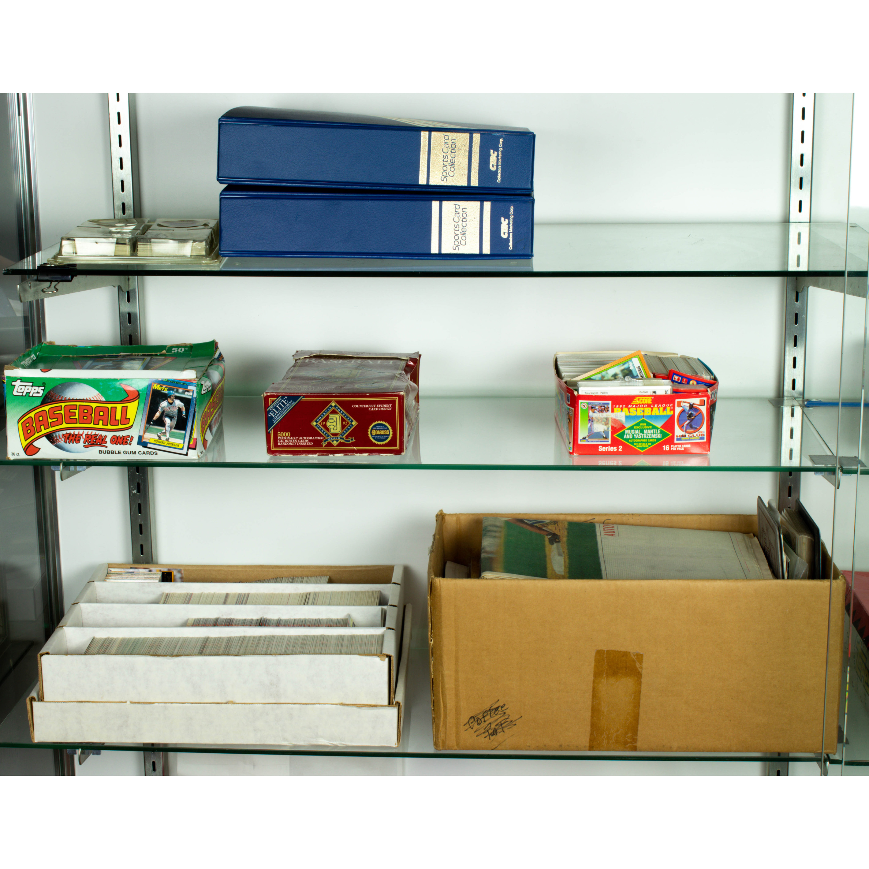 Appraisal: THREE SHELVES OF BASEBALL CARDS Three shelves of baseball cards