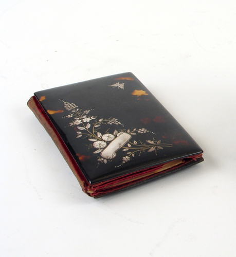 Appraisal: A TORTOISE SHELL COVERED NOTEPAD inlaid with a sterling silver