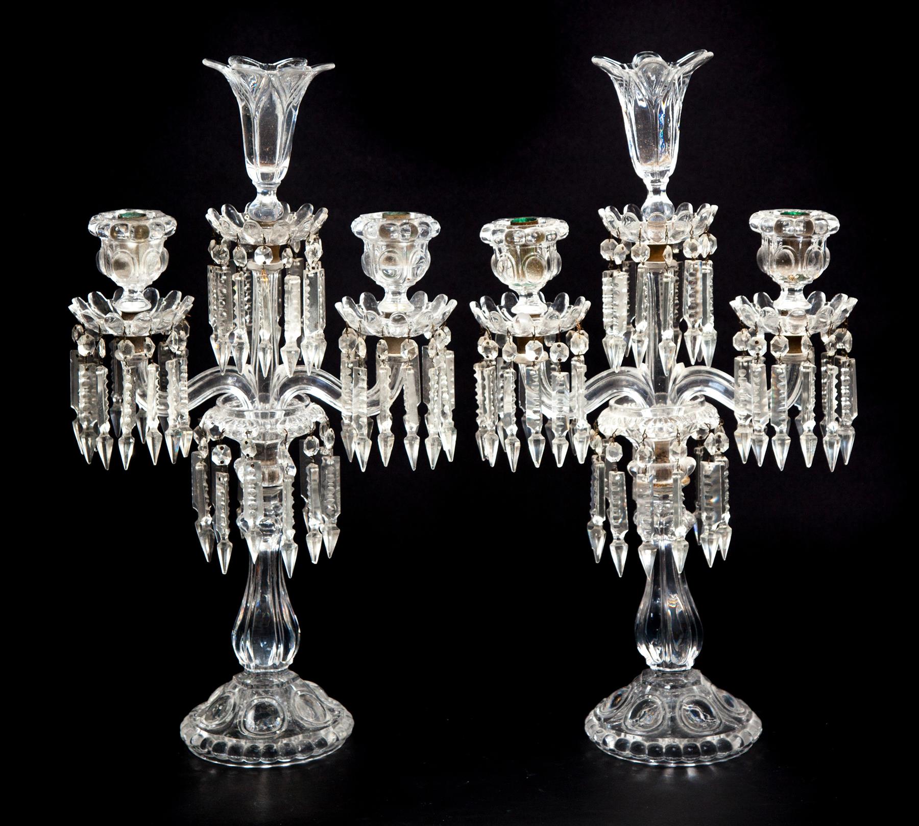 Appraisal: PAIR OF CLEAR PRESSED FLINT GLASS THREE-BRANCH CANDELABRA France st