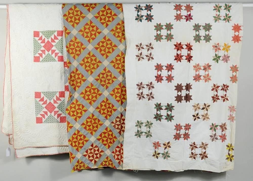 Appraisal: Three American Geometric Patterned Quilts Three American geometric patterned quilts