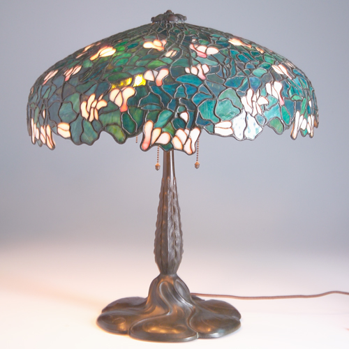 Appraisal: GORHAM Rare table lamp with an asymmetrically-bordered leaded glass shade