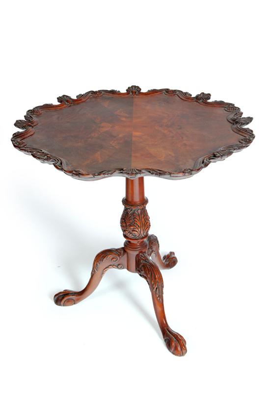 Appraisal: CARVED CHIPPENDALE-STYLE TEA TABLE American or European mid th century