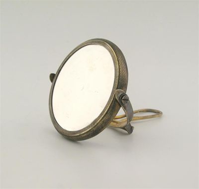 Appraisal: An Edwardian silvergilt double sided shaving mirror by Norman Marshall