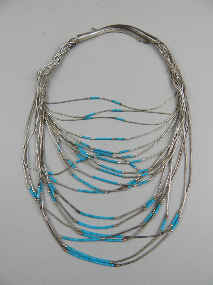 Appraisal: A modern necklace with thin multi bead design in blue