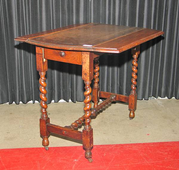 Appraisal: A Charles II style oak drop leaf table mid th