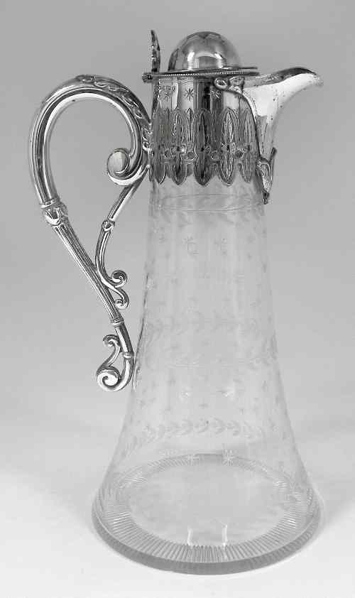 Appraisal: A Victorian etched glass cylindrical claret jug with splayed base