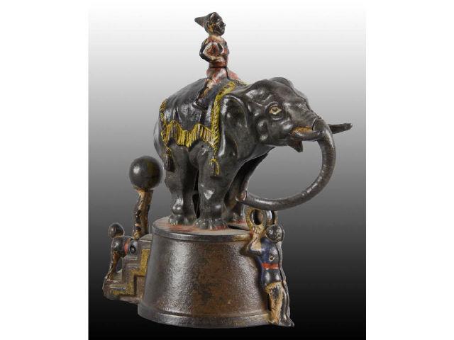 Appraisal: Cast Iron Elephant and Clowns Mechanical Banks Description All original